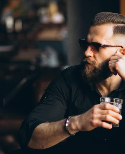 08f4e067-0a54-4f61-bf95-66306176f5d6-bearded-man-drinking-bar.jpg